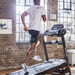 Man running on a ZJET 460 bluetooth treadmill