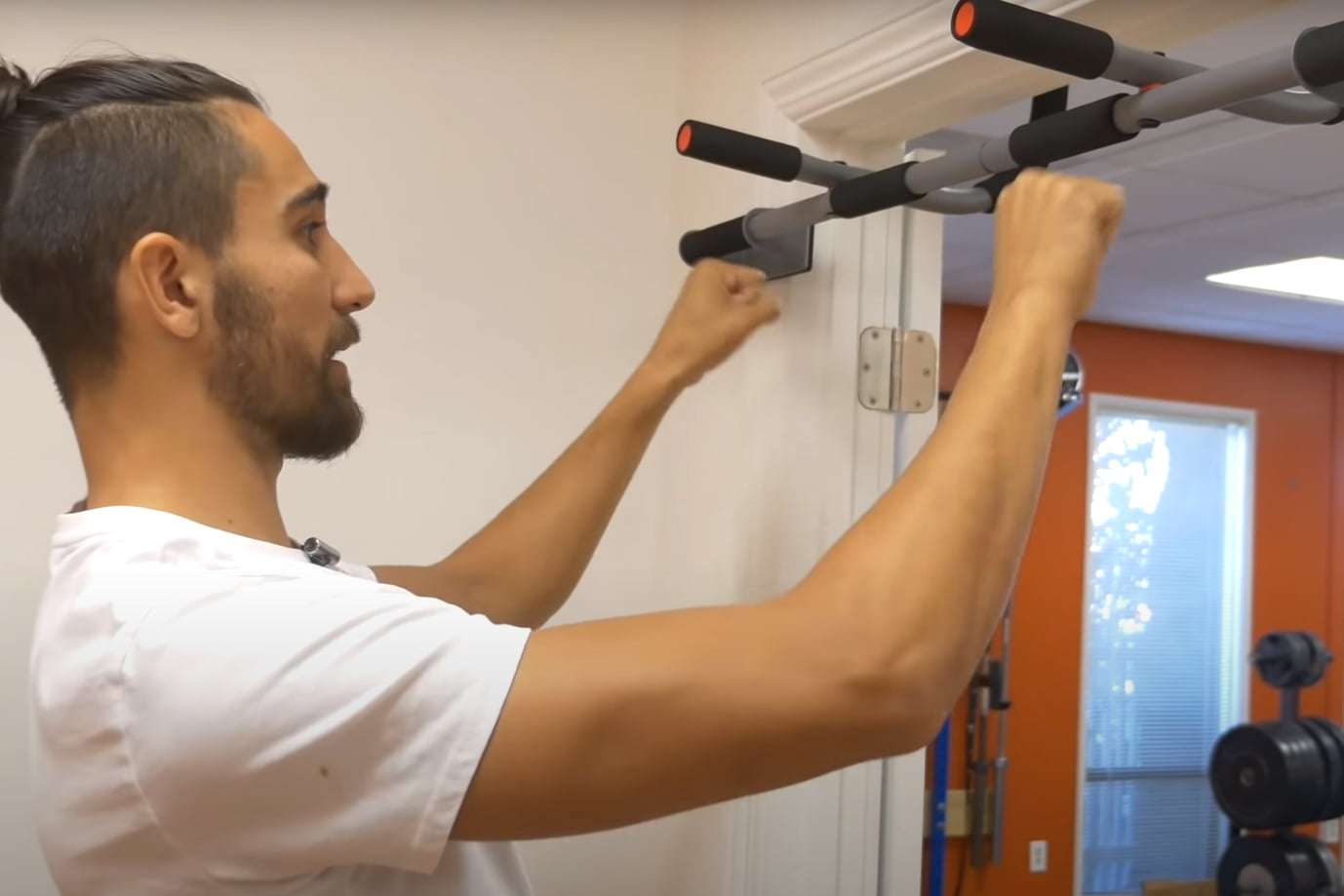 Man doing pull ups on home bar