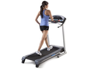 Girl using Weslo cadence R5.2 treadmill behind